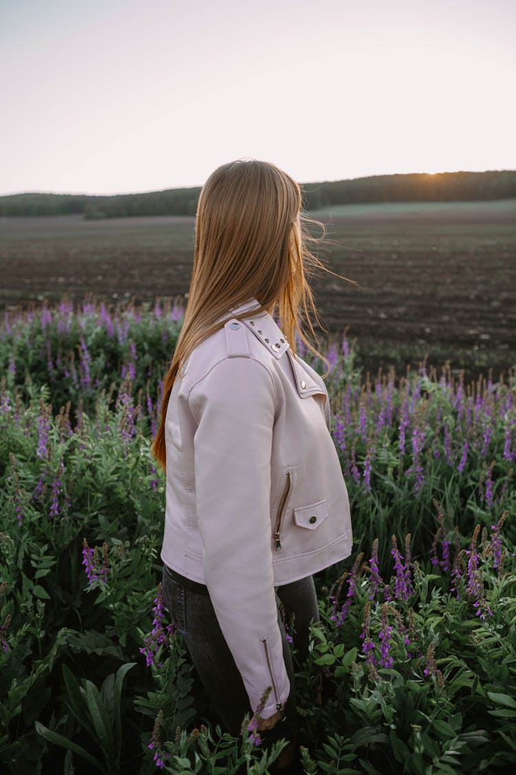 Woman Walking Through Lavender Field