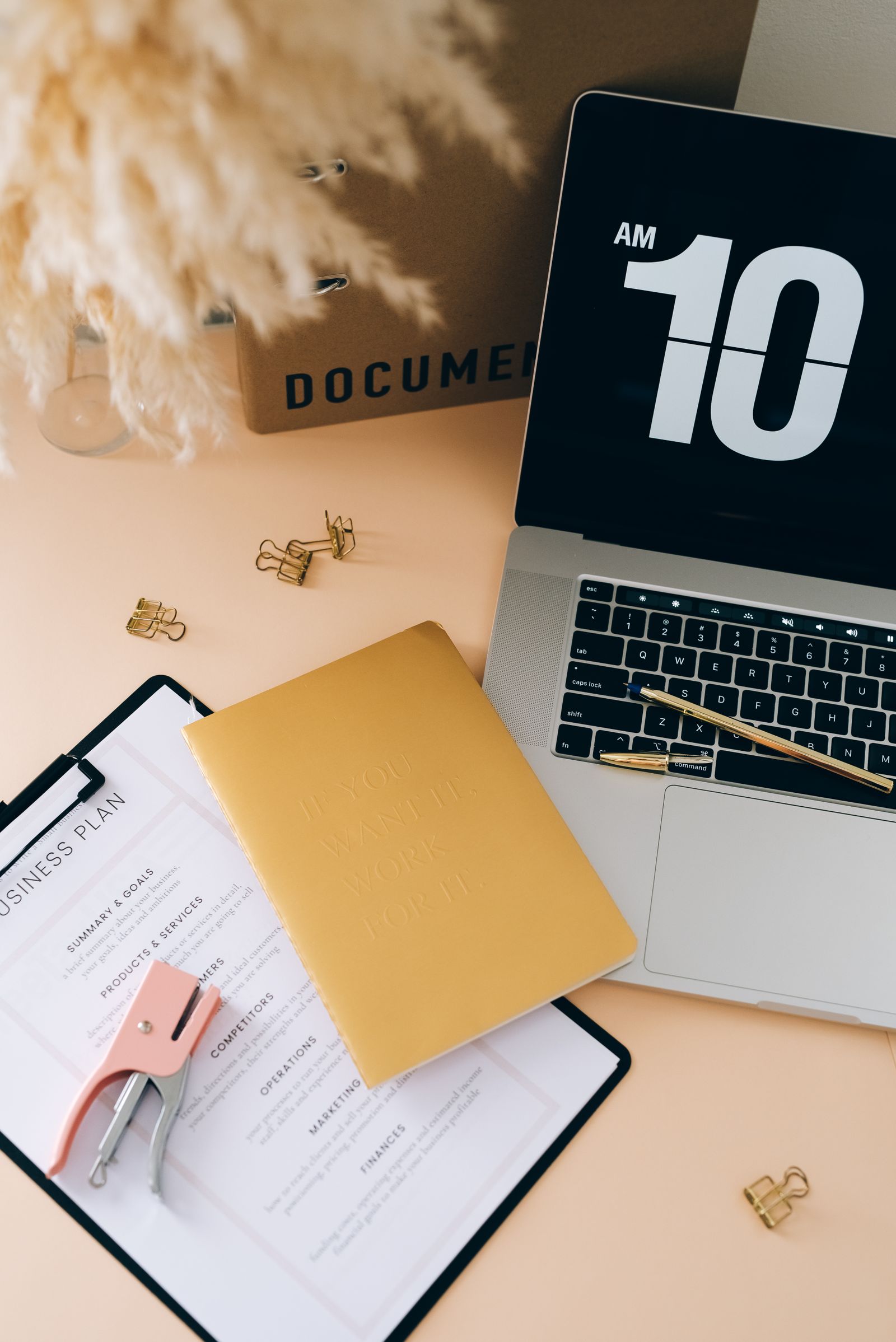 Business planning desk with laptop and documents for local SEO strategy