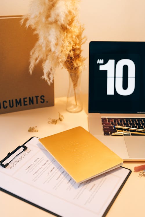 Documents, Pens and Laptop on a Desk