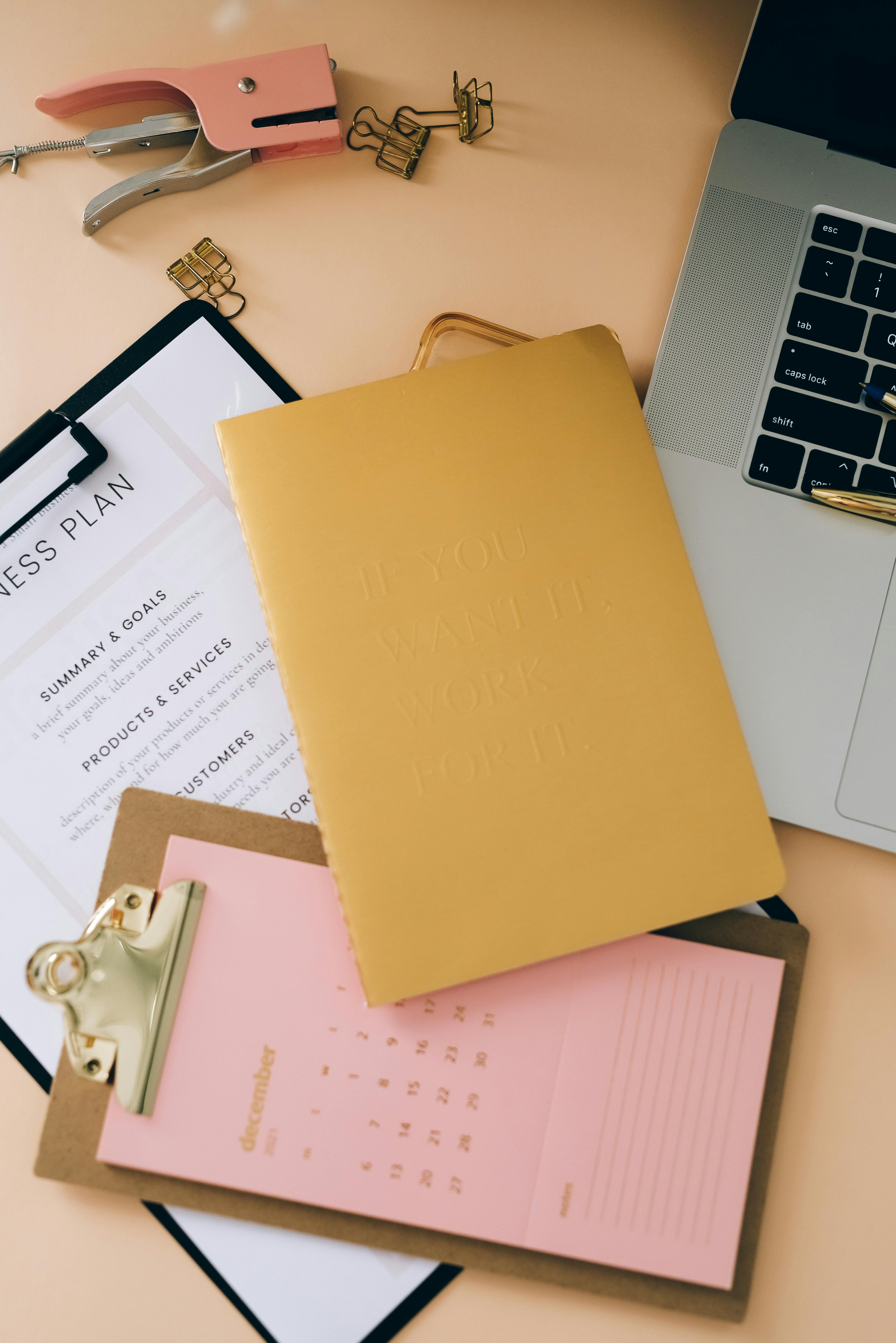 puncher clipboards and a laptop