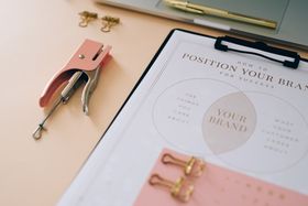 Printed brand cards arranged in a grid — Leeloo The First on Pexels