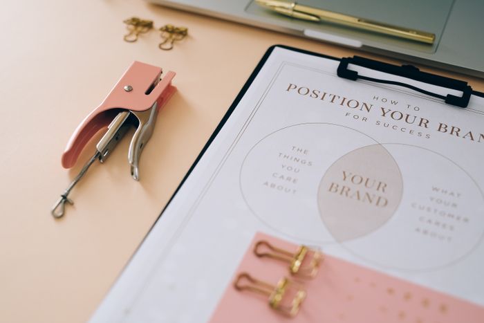 Brand positioning worksheet on a clipboard — photo by Leeloo The First on Pexels