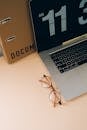 A Laptop and Eyeglasses on the Table