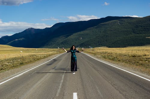 A Woman Standing on the Road