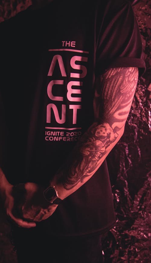 A Tattooed Person in Black Shirt 