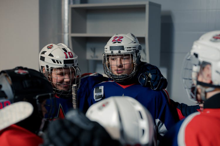 Boys In Sports Uniform In The Locker Room