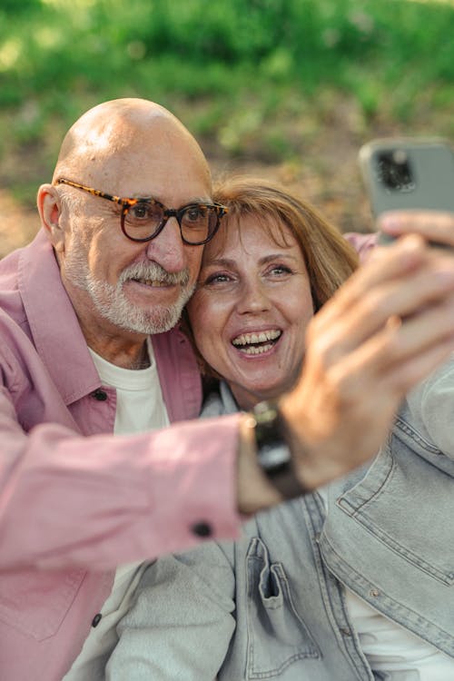 An Elderly Couple Taking a Selfie 