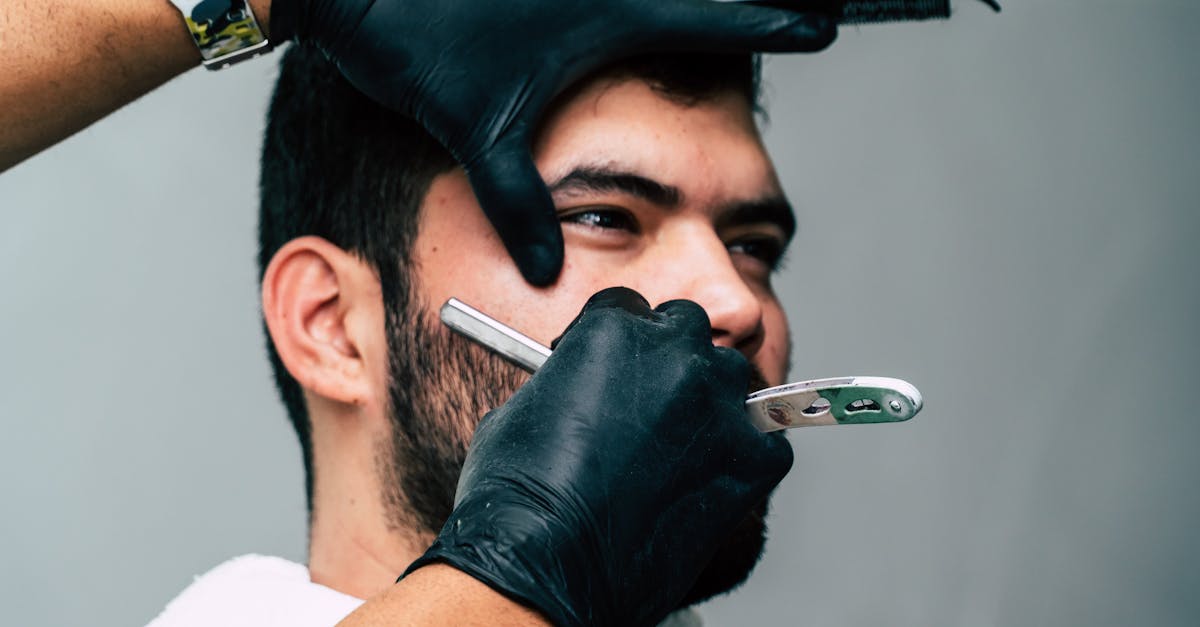 Person Shaving a Man\'s Face With Straight Razor