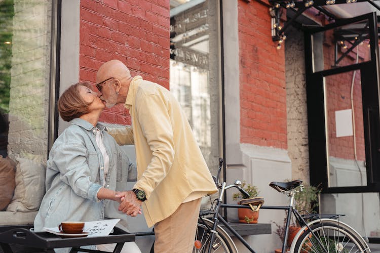 An Elderly Couple Kissing