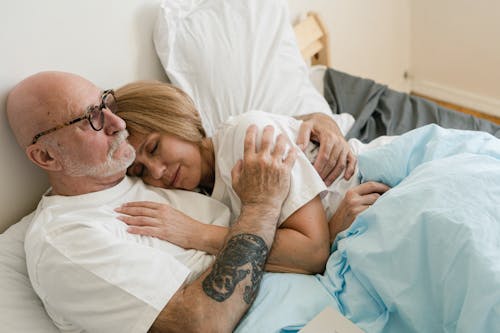 A Couple Lying on the Bed 