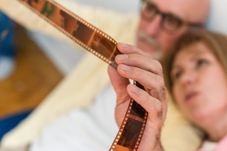 A Couple Looking At A Film