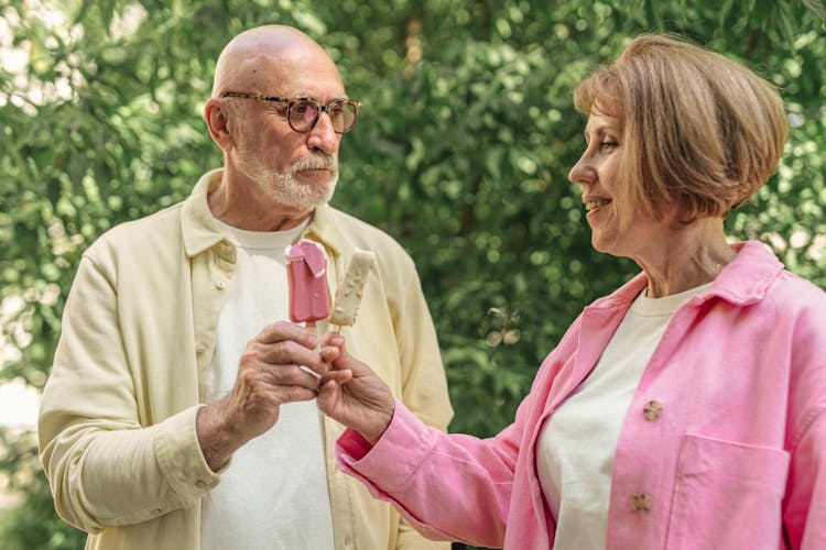 Elderly Couple Holding Ice Creams