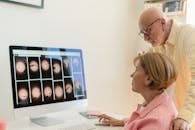 An Elderly Couple Looking at the Computer Screen Together