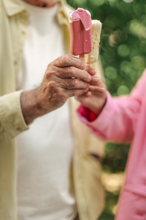 Two Elderly People Holding Ice Cream