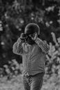 Grayscale Photo of Man Wearing Sunglasses and Plaid Shirt