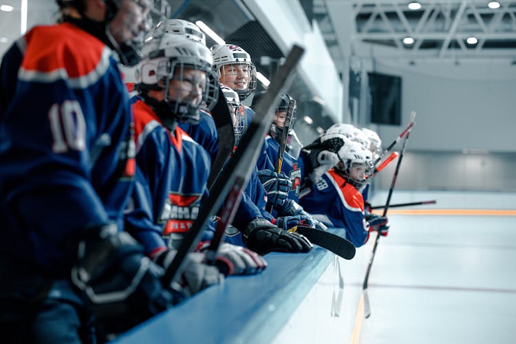 Hockey Players Holding Hockey Sticks