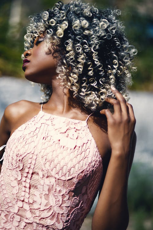 Free Woman Wearing 2-tone Beige Floral Spaghetti Strap Top Stock Photo