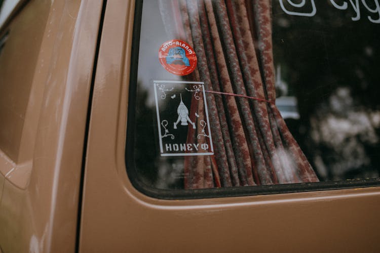 Brown Curtain On Brown Car Window