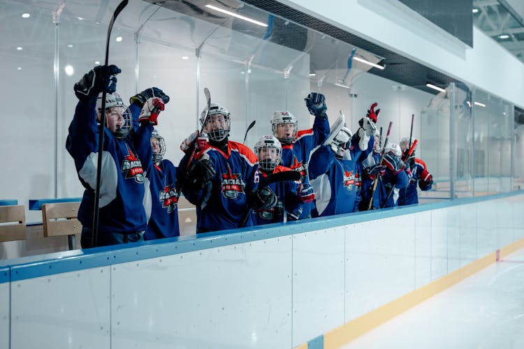 Team Of Hockey Players Cheering Together