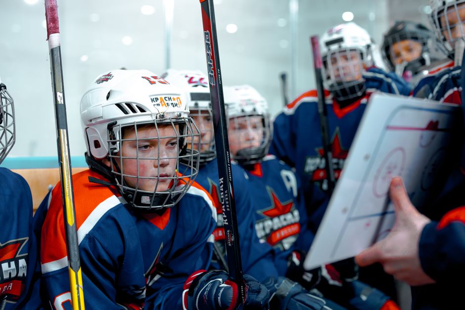 coach reviewing tournament checklist with team roster