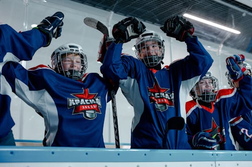 People Wearing Blue and White Hockey Jersey