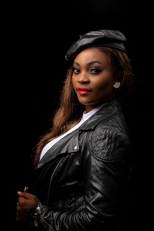 Woman in Black Leather Jacket and Beret With Full Makeup