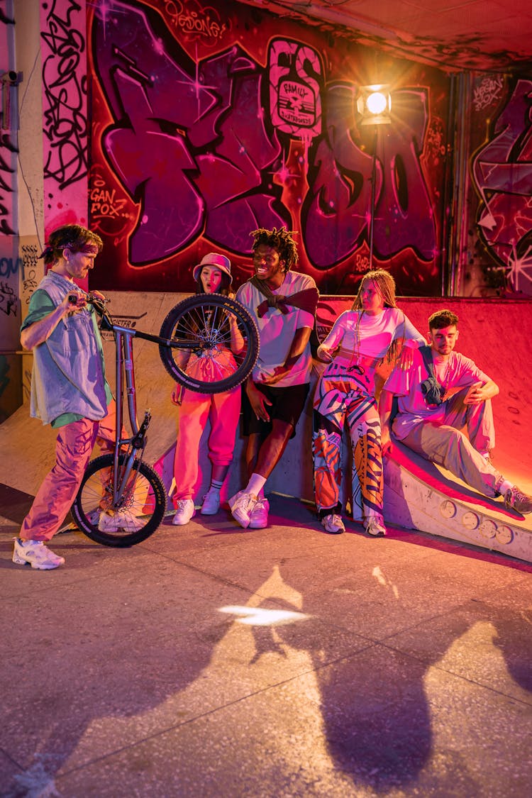 Young People In Streetwear Hanging Out At A Skate Park