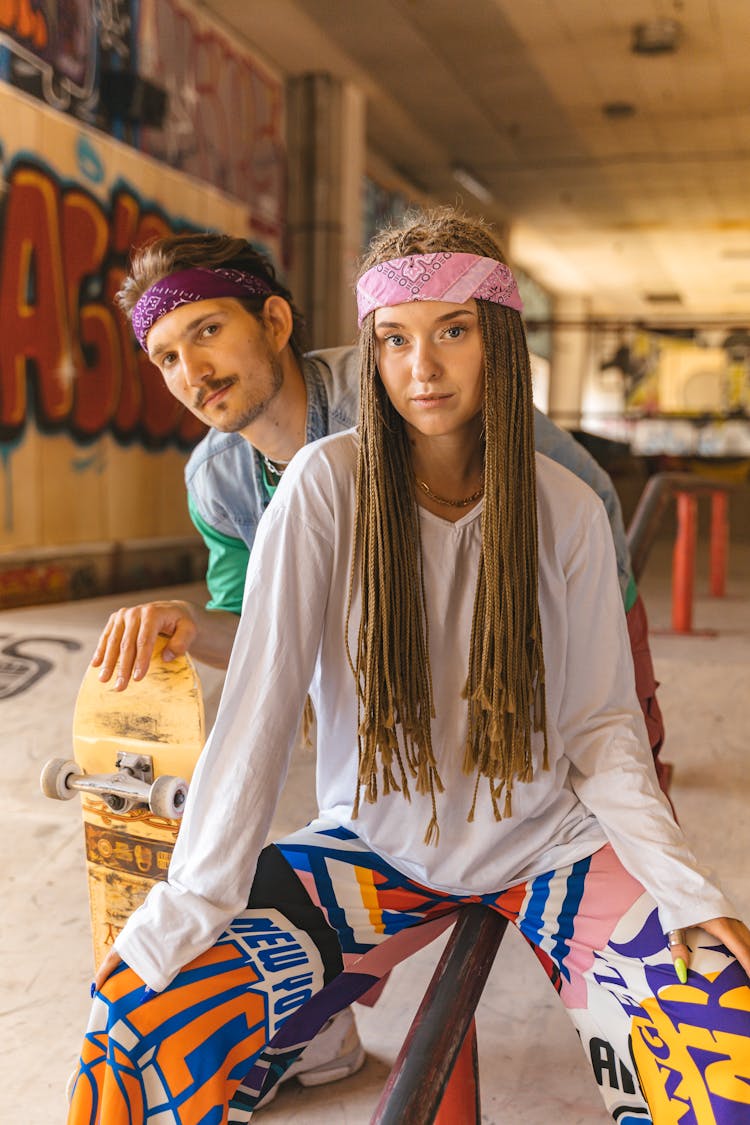 Couple Posing On Skating Rink