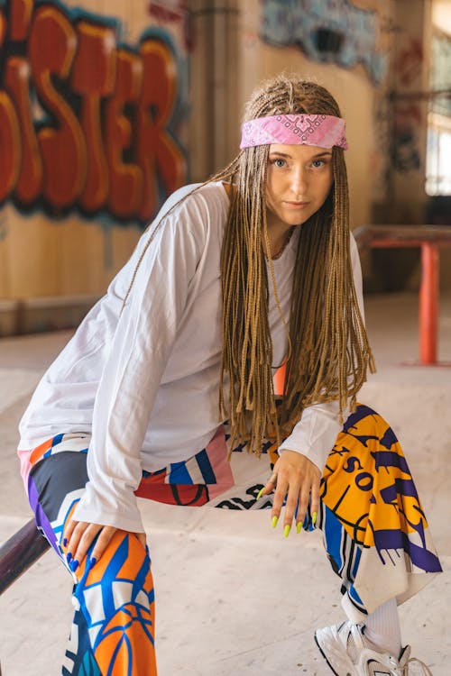 Young Woman in Casual Fashionable Clothes and Bandana on Her Head 