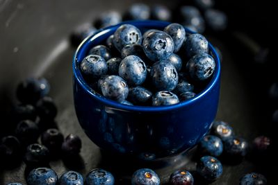 Blueberries in a dark blue bowl. Photo by Philippa Jean-Mather Brown on Pexels