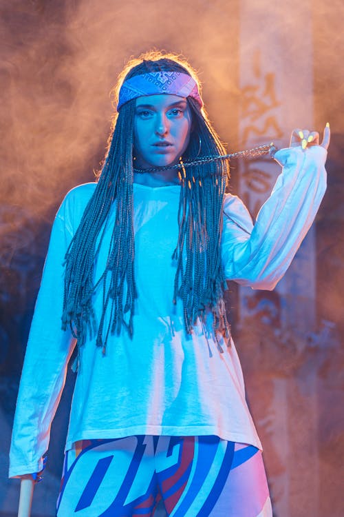 Woman in Box Braids on Stage 