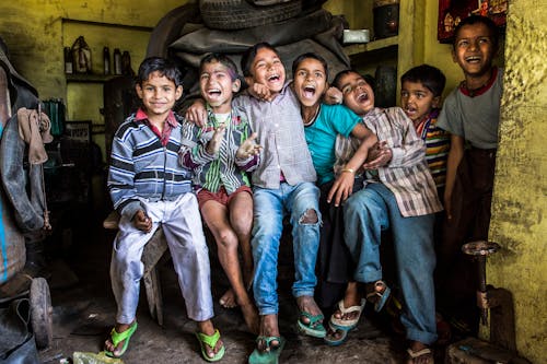 Photo of Children Sitting On A Bench Full of Happiness