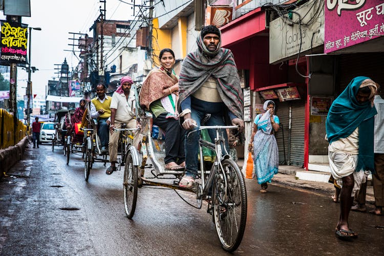 People Riding Rickshaws