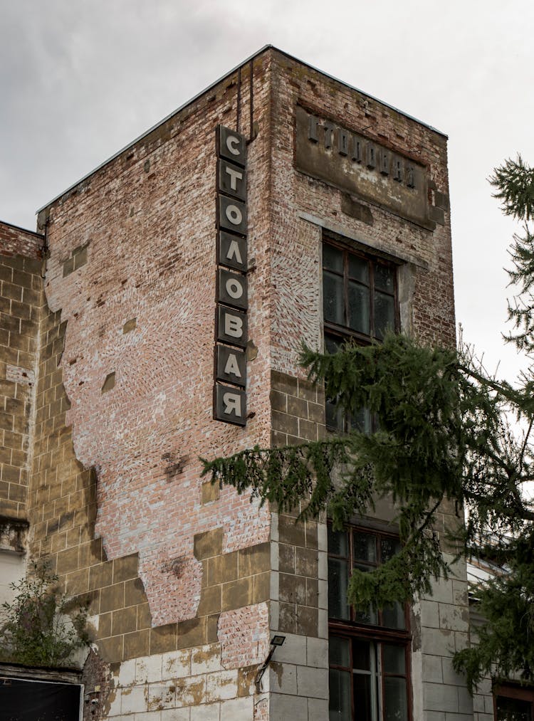 Old And Decaying Building With Signage