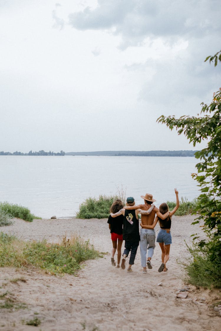 People Walking Together Near A Beach