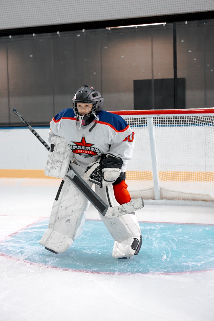 Hockey Player Protecting The Goal