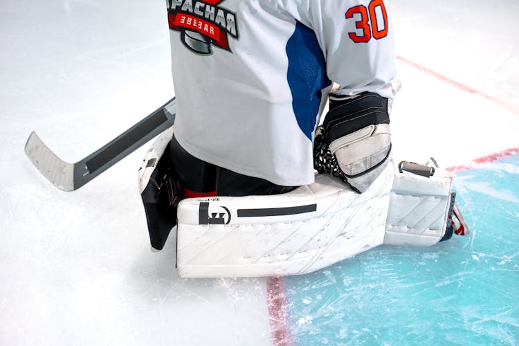 Hockey Jersey And Equipment On The Ground