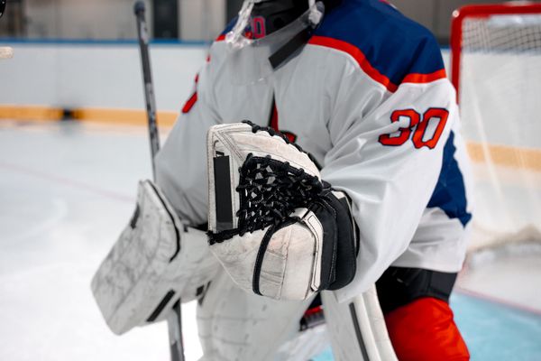 Goaltender set in the crease with the glove up — photo by Ron Lach on Pexels