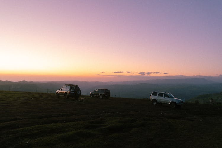 Cars Parked On A Field