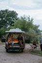 Young Friends Hanging Out at a Camper Van