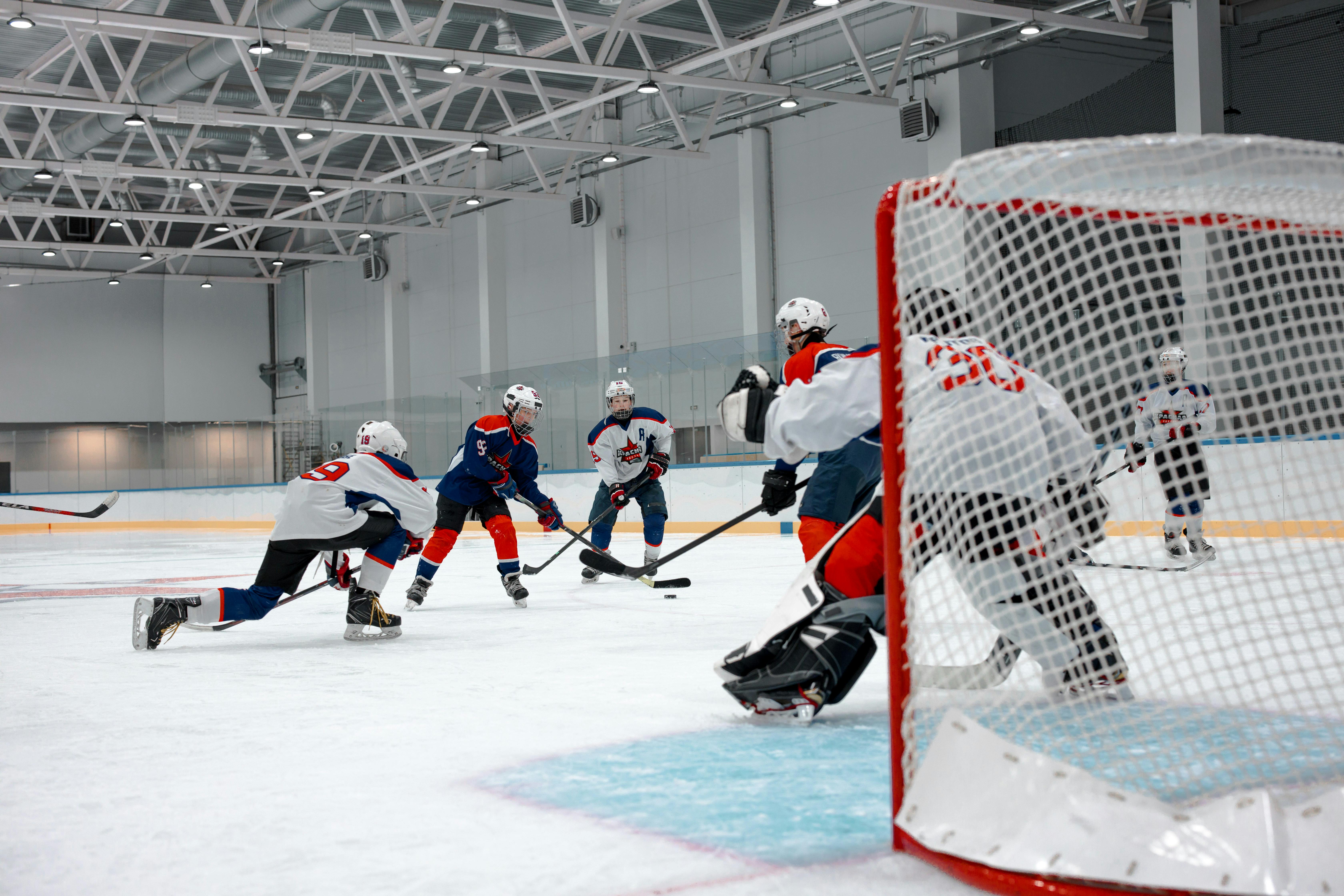 people playing ice hockey on ice rink