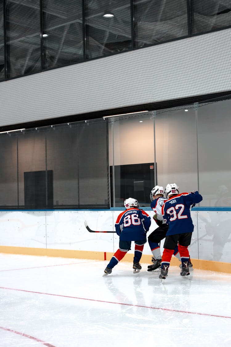 Back View Of People Playing Ice Hockey 