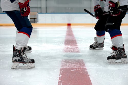Hockey Players Playing on Ice