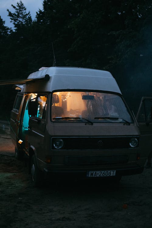 Free Blue Van With Brown and White Tent on Top Stock Photo