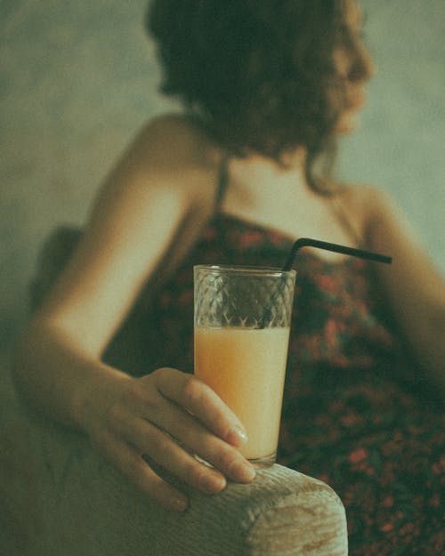 Woman Holding Glass of Juice 
