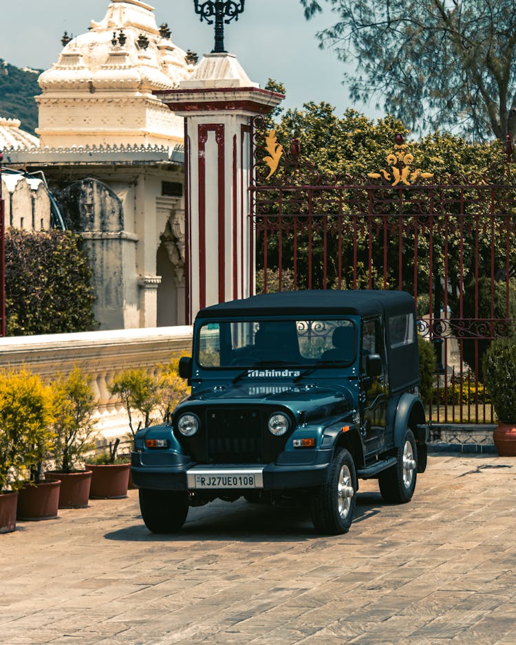 Black Jeep  Parked On Concrete Road