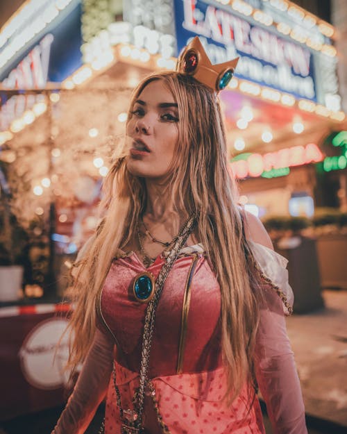 Woman in Red Off Shoulder Dress Wearing a Crown