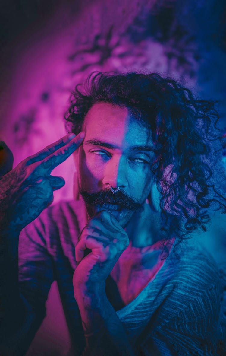 Man With Curly Hair And Moustache