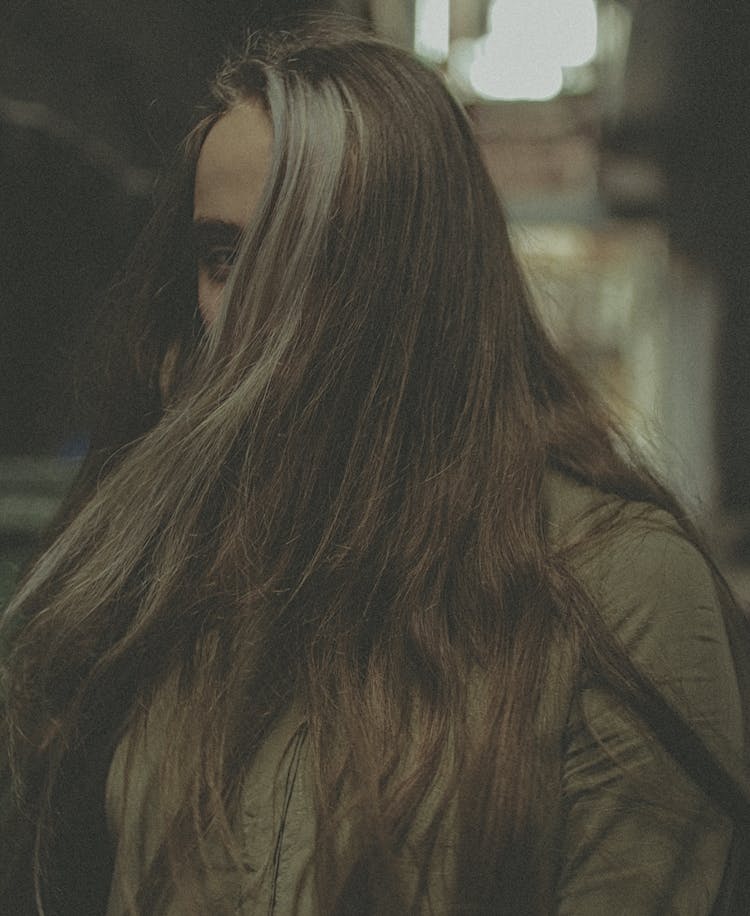 Portrait Of Woman With Face Hidden Behind Hair