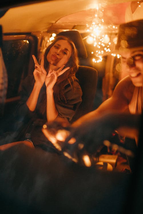 Woman in Black Jacket Sitting on Passenger Seat